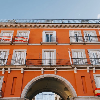 Bright orange building with an archway